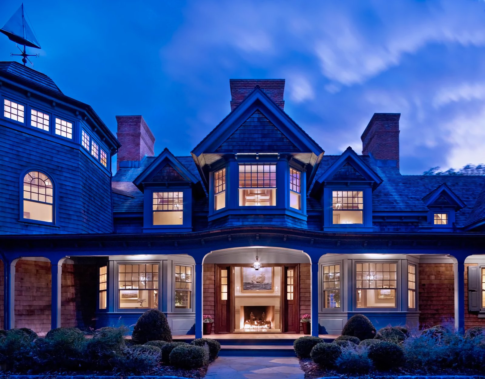 Shingle-style estate at dusk